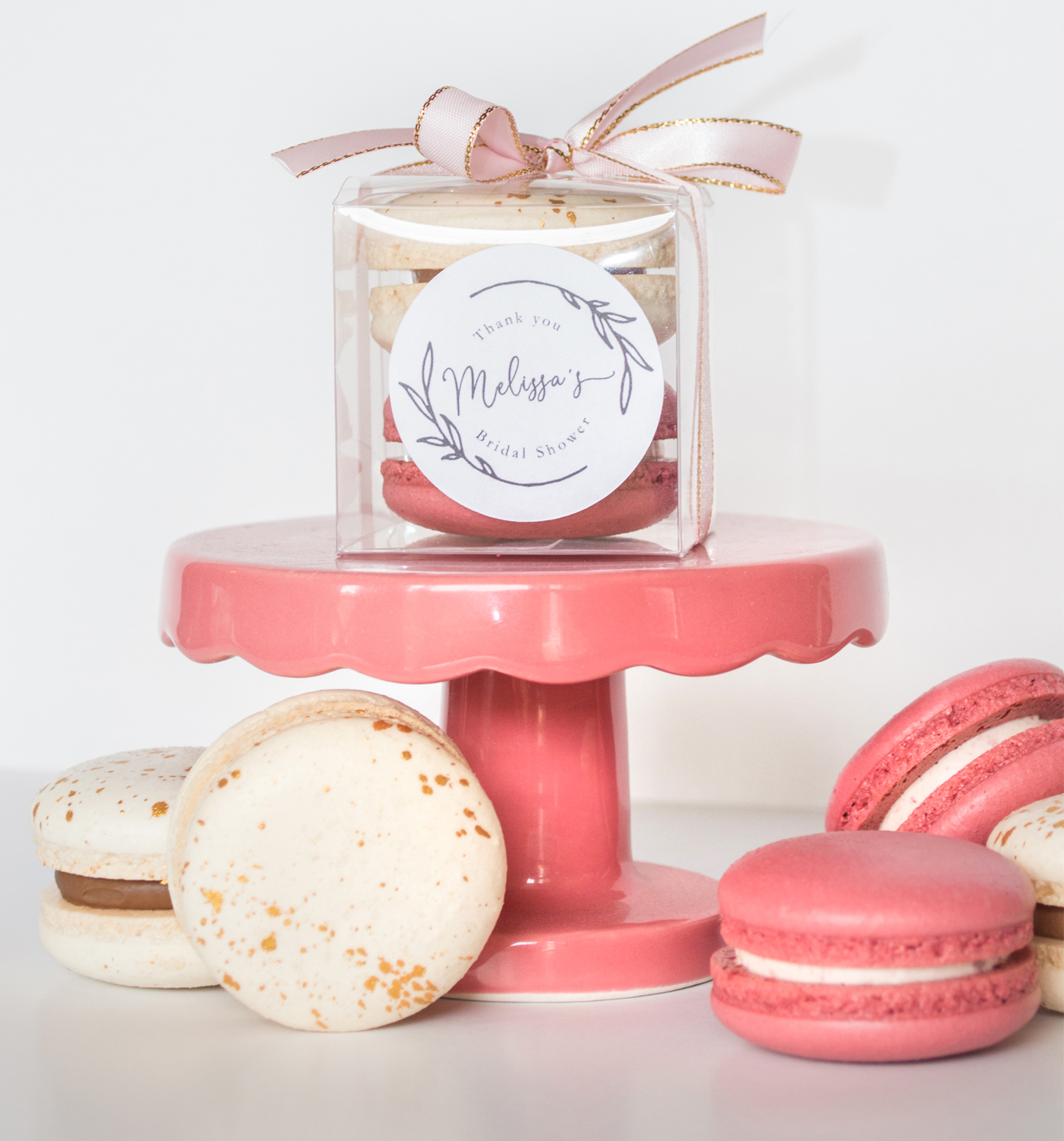 macarons in a box on a mini pedastal